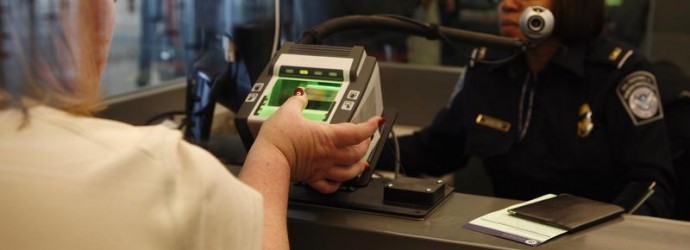 Traveler has her fingerprints scanned at international travel entry point at JFK International Airport in New York